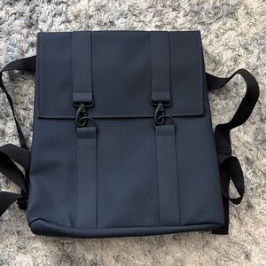 Rains Navy Blue Roll-Top Backpack, washable , good size for travel